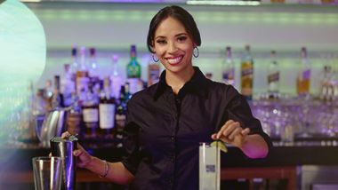 A asian lady making drinks