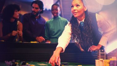A lady working the blackjack table. 